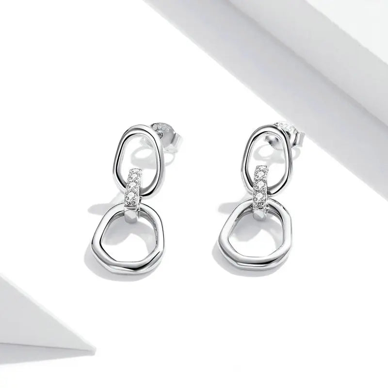 Boucles d'oreilles géométriques en argent S925 avec cristal blanc
