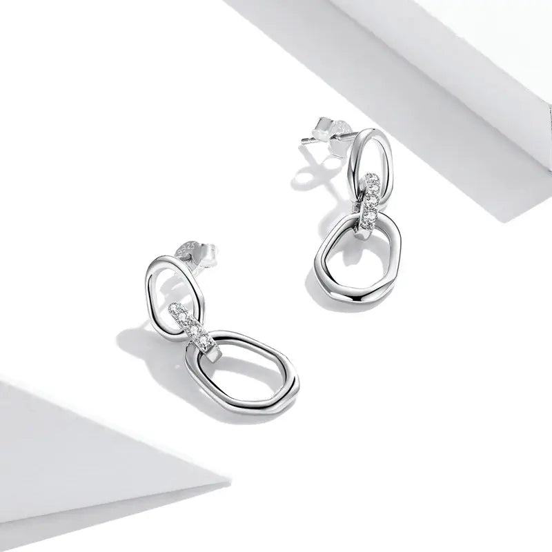 Boucles d'oreilles géométriques en argent S925 avec cristal blanc