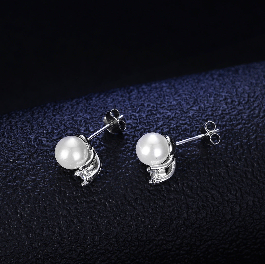 Boucles d’oreilles élégantes en perles et diamants